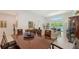 Spacious living area with hardwood table, comfortable seating, and bright, open space at 2135 Hyde Park St, Sarasota, FL 34239