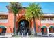 Charming entrance of Morton's Market surrounded by palm trees in a lovely neighborhood at 2135 Hyde Park St, Sarasota, FL 34239