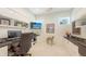 Bright office space with built-in shelving, desk space and a flat screen TV at 2135 Hyde Park St, Sarasota, FL 34239