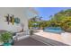 Backyard with water feature, patio furniture, and meticulous landscaping offering a serene outdoor retreat at 2135 Hyde Park St, Sarasota, FL 34239