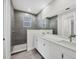 Modern bathroom featuring double vanity, spacious shower, and tile flooring at 2258 Margaret Ln, North Port, FL 34286