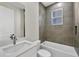 Bathroom featuring a tub and shower combination with gray-toned tile at 2258 Margaret Ln, North Port, FL 34286