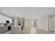 Modern kitchen featuring stainless steel appliances, a large island, and recessed lighting at 2258 Margaret Ln, North Port, FL 34286
