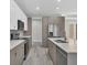 Beautiful kitchen with stainless steel appliances, quartz countertops, and modern fixtures at 2258 Margaret Ln, North Port, FL 34286