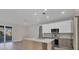 Open kitchen layout with an island, modern appliances, and recessed lighting at 2258 Margaret Ln, North Port, FL 34286