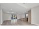Open-concept living room with recessed lighting, sliding glass doors, and wood floors at 2258 Margaret Ln, North Port, FL 34286