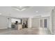 Bright living space with hardwood floors, modern kitchen, and recessed lighting at 2258 Margaret Ln, North Port, FL 34286
