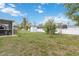 Large backyard with ample space, enclosed by a white fence, great for various outdoor activities at 2341 Sheila Ln, North Port, FL 34286