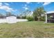 Spacious backyard with a white storage shed and plenty of open space for recreation at 2341 Sheila Ln, North Port, FL 34286