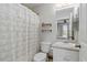 Clean bathroom with white fixtures, a shower, and a decorative shower curtain at 2341 Sheila Ln, North Port, FL 34286