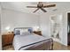 Comfortable bedroom with ceiling fan and ensuite bathroom at 2341 Sheila Ln, North Port, FL 34286