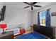 room with wood floors, a ceiling fan, and a view to the outside at 2341 Sheila Ln, North Port, FL 34286