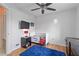 bedroom with wood floors, a ceiling fan, and crib at 2341 Sheila Ln, North Port, FL 34286