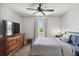 Inviting bedroom with neutral tones, ceiling fan, and natural light at 2341 Sheila Ln, North Port, FL 34286