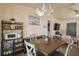 Charming dining room with stylish lighting, decor, and a rustic table at 2341 Sheila Ln, North Port, FL 34286