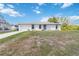 Charming one-story home with a well-manicured lawn, an attached garage, and inviting curb appeal at 2341 Sheila Ln, North Port, FL 34286