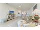 A bright and airy living room featuring a comfortable seating area and stylish decor at 24065 Canterwood Way, Venice, FL 34293