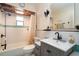 Neat bathroom featuring tile flooring, updated fixtures, and a shower at 2715 36Th Avenue E Ter, Bradenton, FL 34208