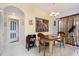 Well-lit dining area with a wooden table, stylish chairs, and an elegant chandelier above at 2715 36Th Avenue E Ter, Bradenton, FL 34208