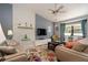 Bright living room featuring textured walls, comfortable seating, and large windows for natural light at 2715 36Th Avenue E Ter, Bradenton, FL 34208