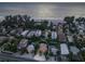 Aerial view of the coastal home, showcasing its proximity to the beach and the surrounding neighborhood at 2908 Gulf Dr, Holmes Beach, FL 34217