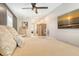 Cozy bedroom with a comfortable bed, hanging chair, and a calming beach-themed wall art at 2908 Gulf Dr, Holmes Beach, FL 34217