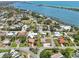 Aerial view of a coastal community with waterfront access and well-manicured lawns and landscaping at 321 Sorrento Dr, Osprey, FL 34229