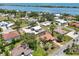 Aerial view of the neighborhood with waterfront views and lush landscaping at 321 Sorrento Dr, Osprey, FL 34229