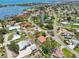 Beautiful aerial view of waterfront community with canals and a glimpse of the ocean in the distance at 321 Sorrento Dr, Osprey, FL 34229