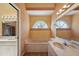 The bathroom includes a large soaking tub and a stylish vanity sink at 321 Sorrento Dr, Osprey, FL 34229