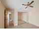 Well-lit bedroom with ceiling fan, mirrored closets and doorway to the en suite bathroom at 321 Sorrento Dr, Osprey, FL 34229