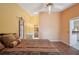 Relaxing bedroom featuring a ceiling fan, skylight, and an adjacent bathroom for added convenience at 321 Sorrento Dr, Osprey, FL 34229