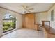 Bedroom with desk, queen Murphy bed, and ceiling fan at 321 Sorrento Dr, Osprey, FL 34229