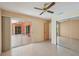 Spacious bedroom with ceiling fan, mirrored closets and sliding glass doors to the lanai at 321 Sorrento Dr, Osprey, FL 34229