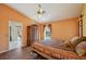 Bedroom boasts a large bed, closet, and views of the pool and back yard at 321 Sorrento Dr, Osprey, FL 34229