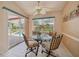 Cozy breakfast nook overlooking the pool with a lovely glass table and 4 cushioned chairs at 321 Sorrento Dr, Osprey, FL 34229