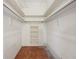 Spacious walk-in closet with shelves and white racks at 321 Sorrento Dr, Osprey, FL 34229