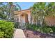 Inviting front entrance with a decorative walkway and mature landscaping at 321 Sorrento Dr, Osprey, FL 34229
