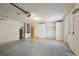Spacious garage with water heater, overhead lighting, and storage cabinets at 321 Sorrento Dr, Osprey, FL 34229