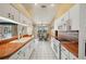 Bright kitchen with white cabinets, terra cotta countertops, and a breakfast nook area at 321 Sorrento Dr, Osprey, FL 34229