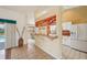 A view of the kitchen and breakfast bar as seen from the home's entrance at 321 Sorrento Dr, Osprey, FL 34229
