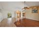 Spacious living room showcases tile and wood floors, a ceiling fan, and natural light at 321 Sorrento Dr, Osprey, FL 34229