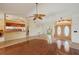 Bright open living area featuring tile floors, arched entryway, and view of the kitchen at 321 Sorrento Dr, Osprey, FL 34229