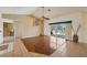 Spacious living room featuring tile and wood flooring with a view of the pool at 321 Sorrento Dr, Osprey, FL 34229