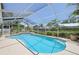 Inviting screened pool with spacious lanai, landscaping, and a serene outdoor oasis at 321 Sorrento Dr, Osprey, FL 34229
