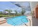 Large screened pool with easy access steps and ample deck space for relaxation and entertaining at 321 Sorrento Dr, Osprey, FL 34229