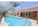 Sparkling screened pool, perfect for relaxation, with lanai and well-maintained deck at 321 Sorrento Dr, Osprey, FL 34229