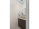 Stylish half bathroom with a round mirror, modern vanity lighting, and a sleek vanity at 3212 Ramblewood N Dr # 3212, Sarasota, FL 34237