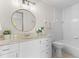 Bathroom featuring a vanity with white cabinets and a tub with white tile surround at 3212 Ramblewood N Dr # 3212, Sarasota, FL 34237