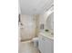 Bathroom featuring a walk-in shower, tile flooring, and a white sink and vanity with gold fixtures at 3212 Ramblewood N Dr # 3212, Sarasota, FL 34237